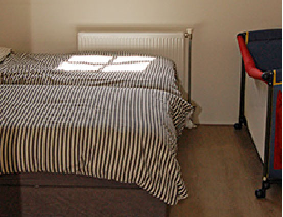 Vakantiewoning Limosa Wieringen - de secundaire slaapkamer met losse boxsprings